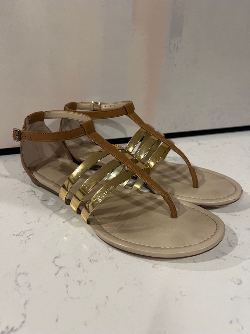 Calvin Klein Sabia flats w/shiny gold metallic front straps size 8
